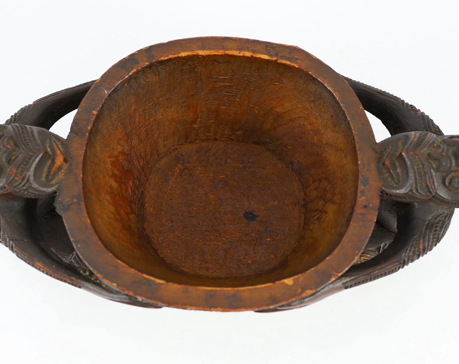 A Maori carved wood oblong bowl and cover, kumete, c.1880-1910, height 23cm length 31cm